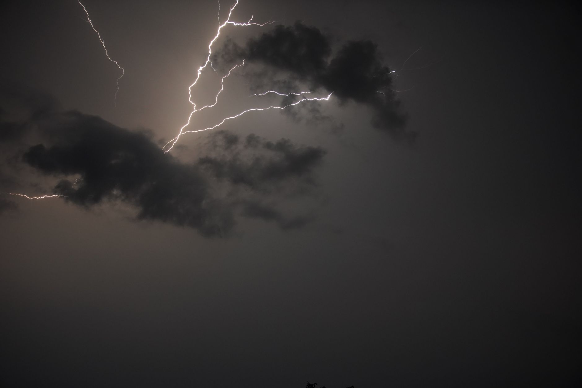 Captivating lightning bolt illuminating dark rain clouds in Bolęcin, Poland.