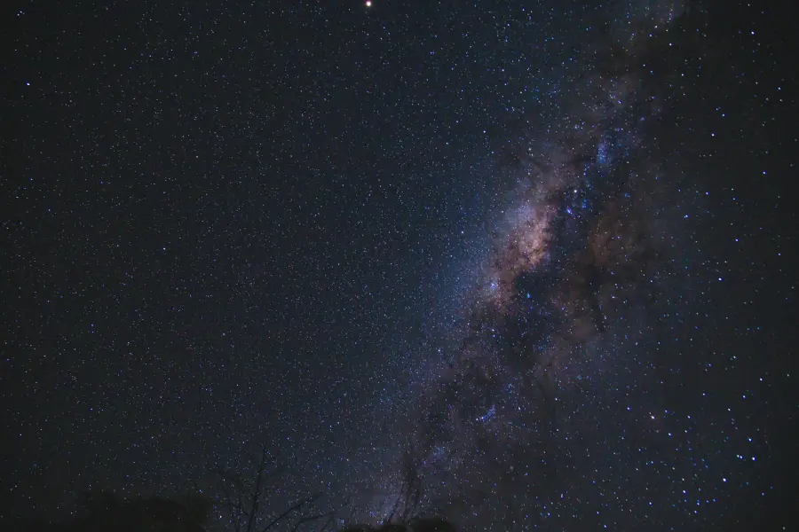 From below of milky way glowing high in air on dark sky with shining stars in nature on night time