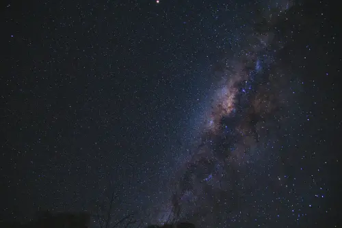 From below of milky way glowing high in air on dark sky with shining stars in nature on night time