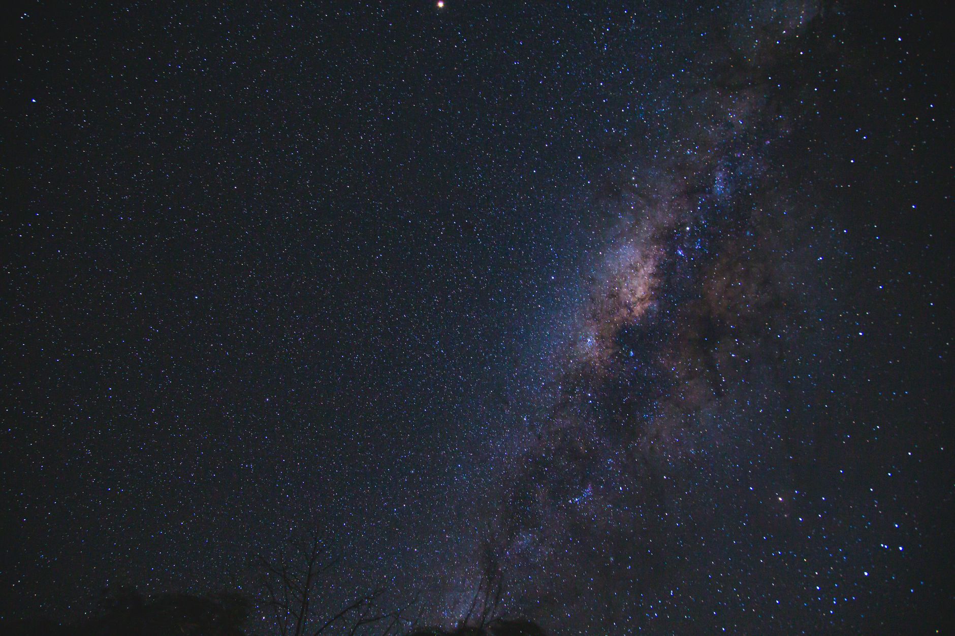 From below of milky way glowing high in air on dark sky with shining stars in nature on night time