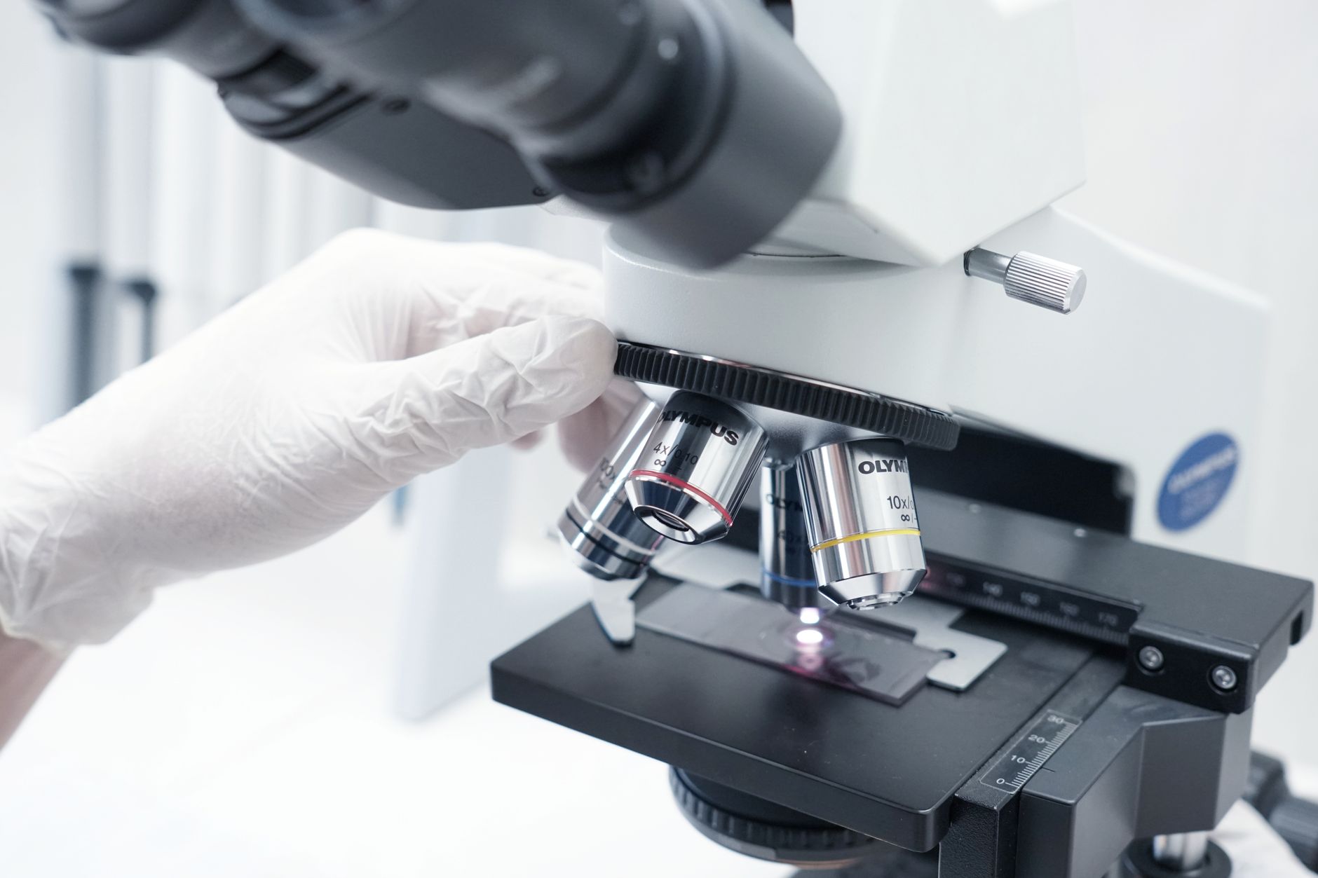 A detailed view of a microscope being used in a modern laboratory.